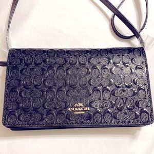 NWT COACH black leather handbag.